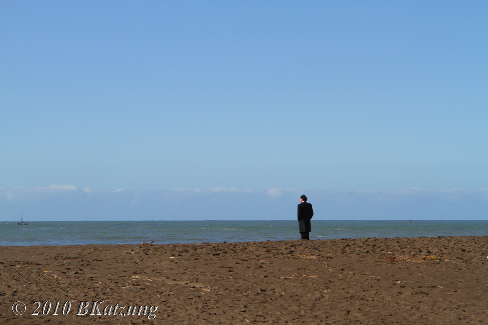 Lonesome man watching a boat at Rodeo Beach