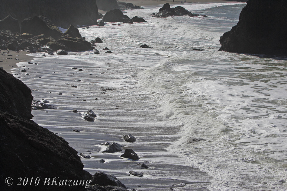 Wave receding from the shoreline at Rodeo Beach
